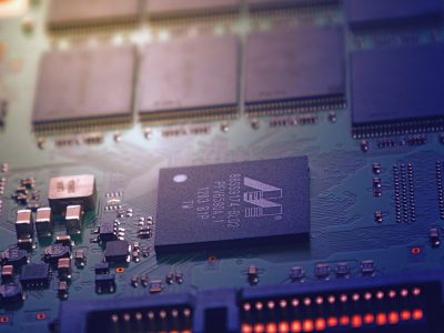 Chips and transistors on computer motherboard
