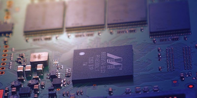 Chips and transistors on computer motherboard